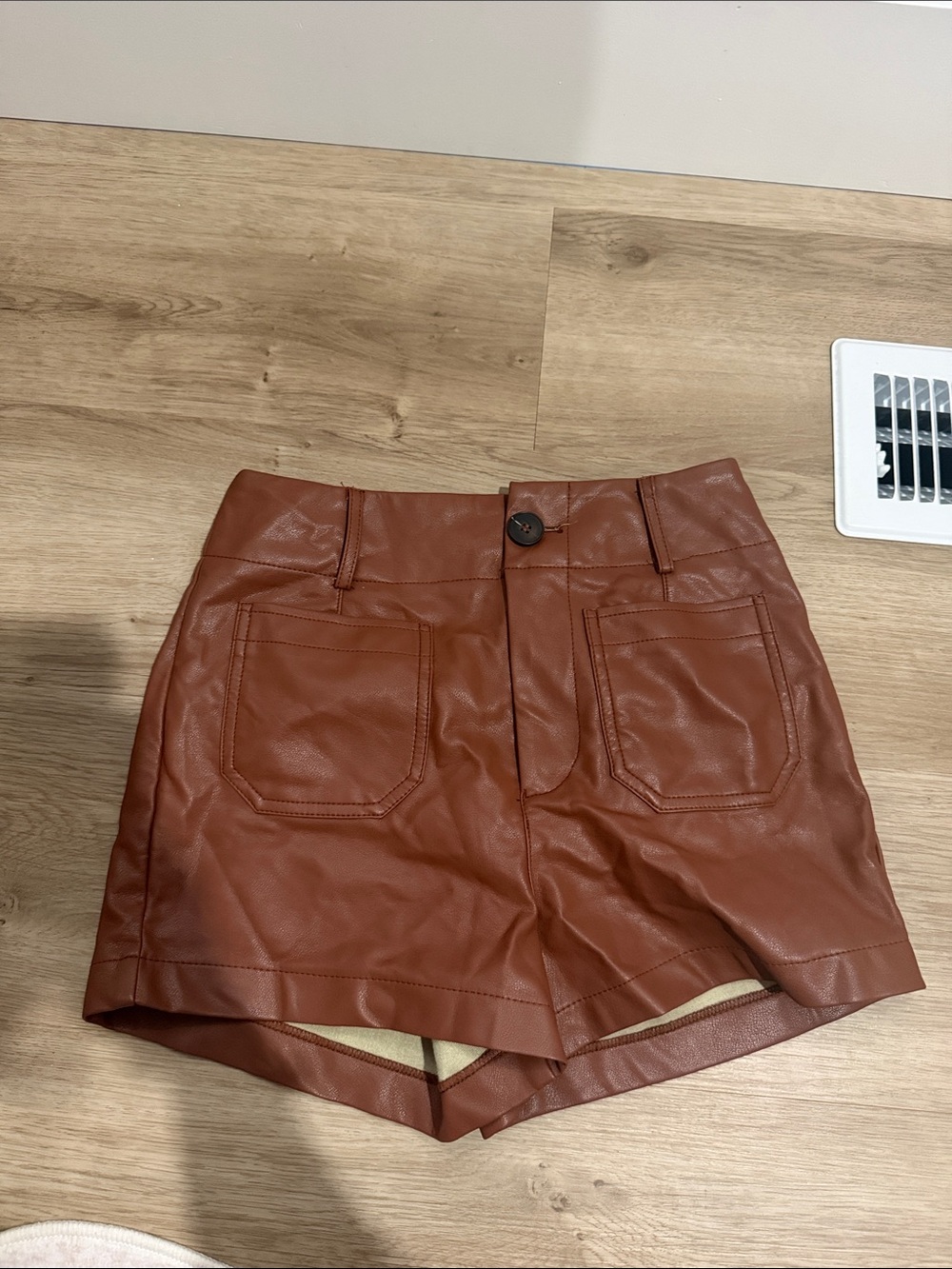 Anthropologie High-Waist Faux Leather Shorts in Chestnut Brown